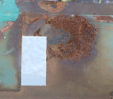 Repair patch on rusty shipping container